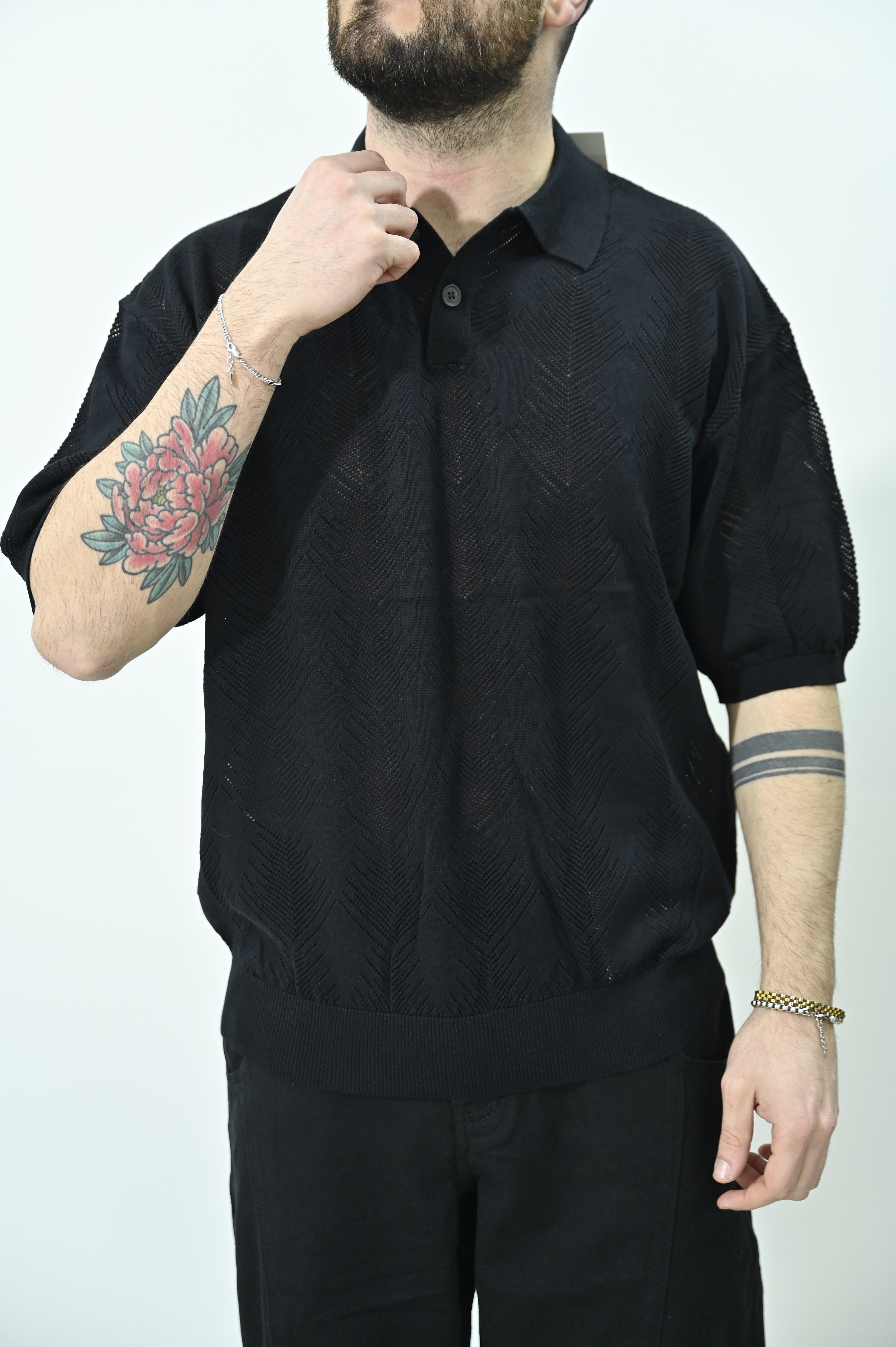 Polo traforata nera